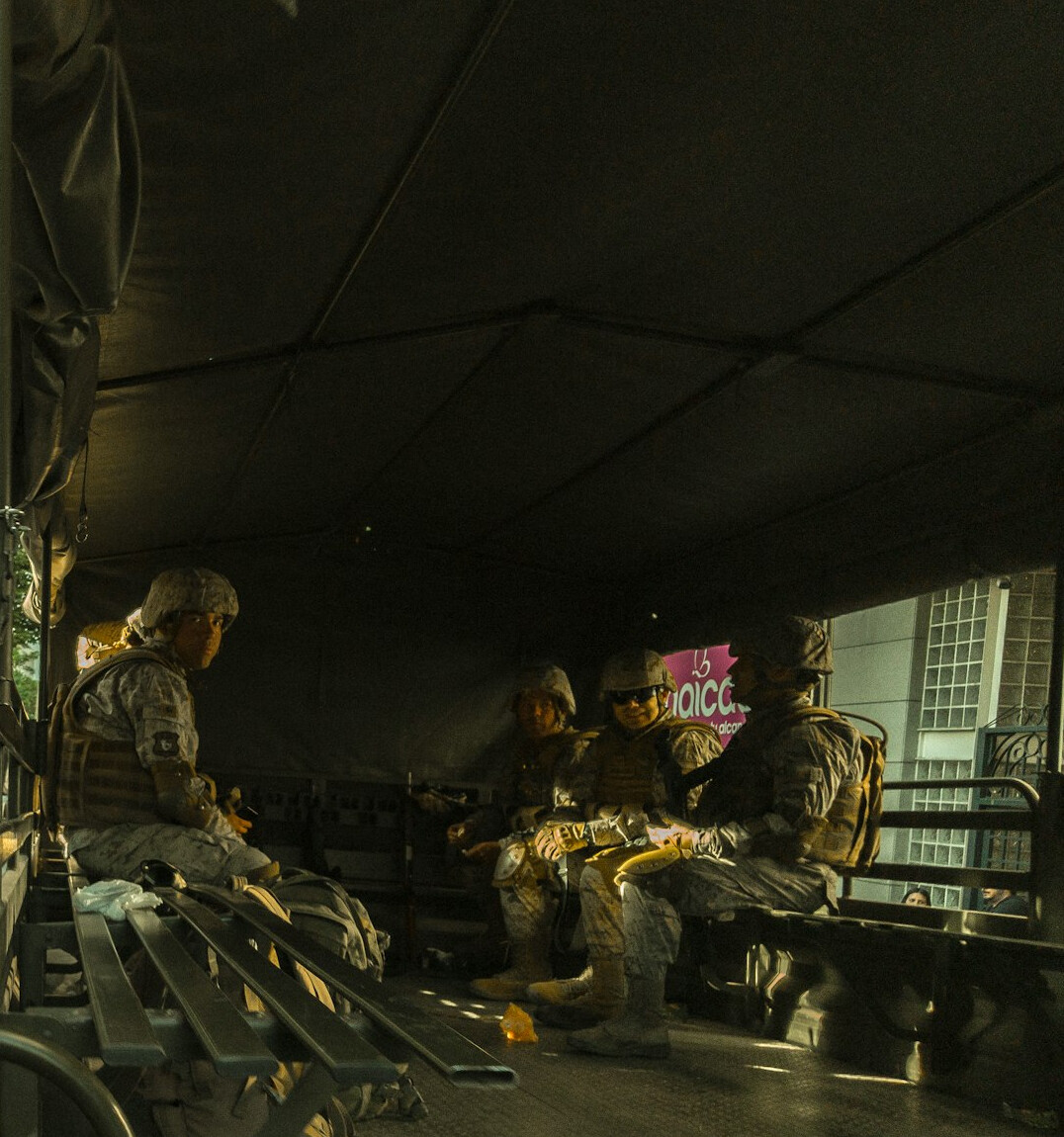 Media operations team collaborating around a planning table with broadcast schedules